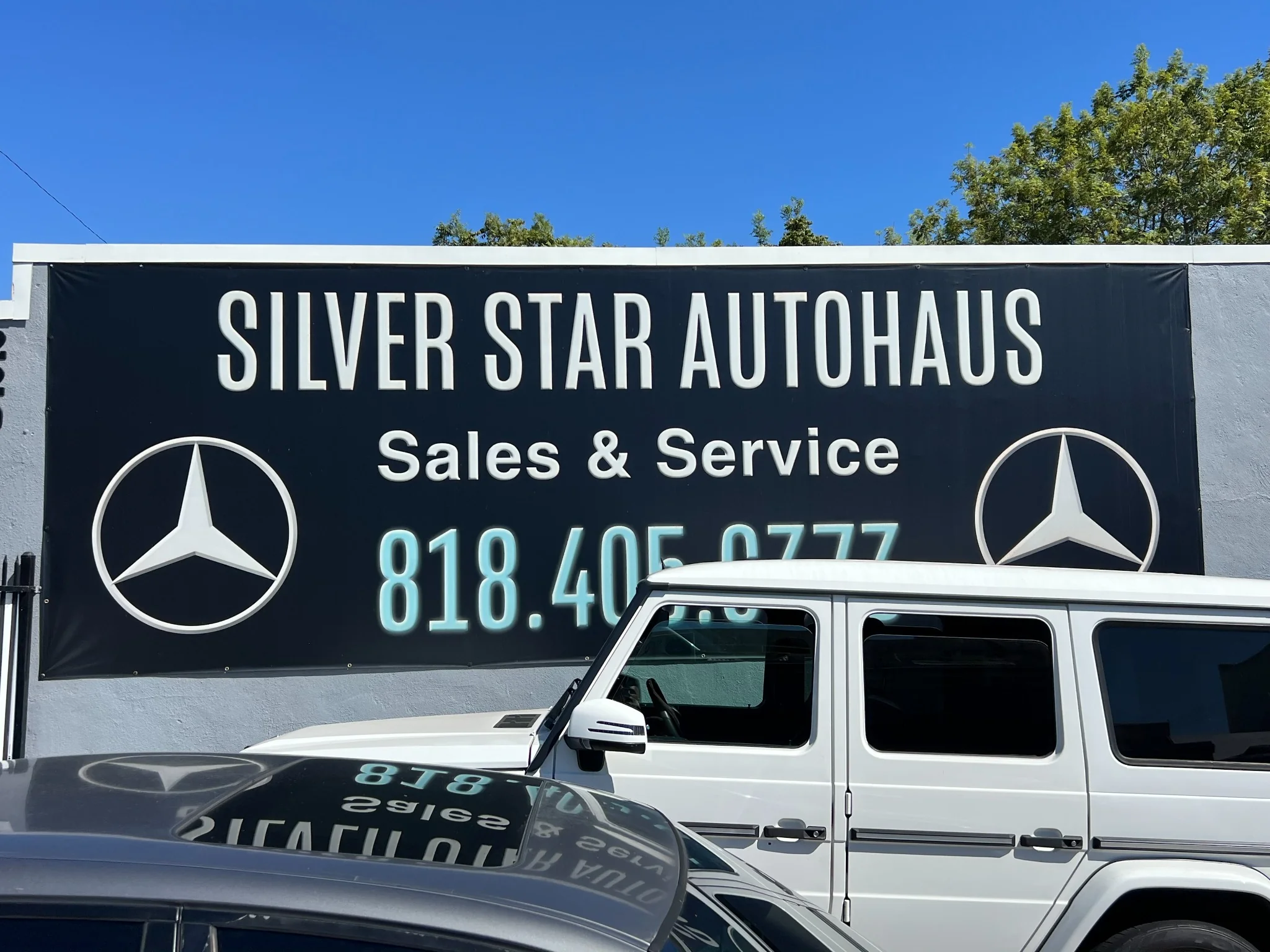 Silver Star Autohaus storefront in Burbank with Mercedes-Benz vehicles parked outside
